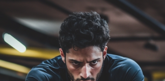 Functional Fitness: Exercises to Improve Daily Performance Featured image of an athlete mastering functional fitness with dynamic, fluid movements in a modern gym.